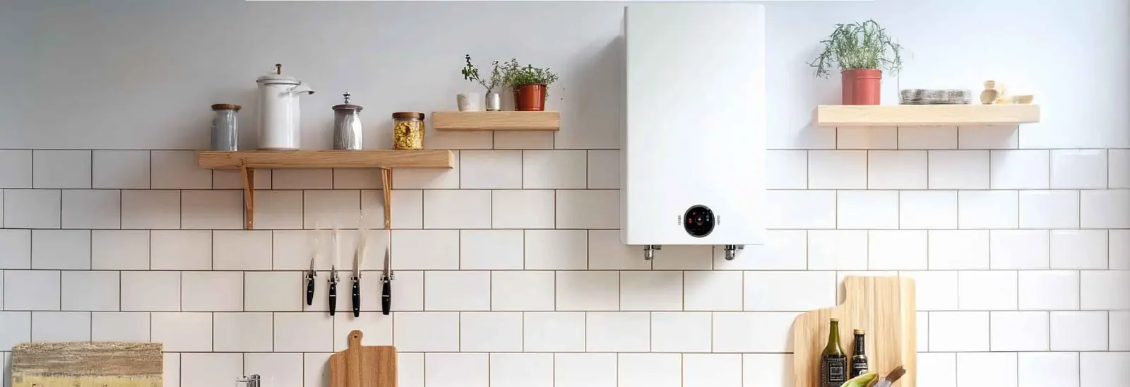 A modern wall-mounted boiler in a tidy kitchen